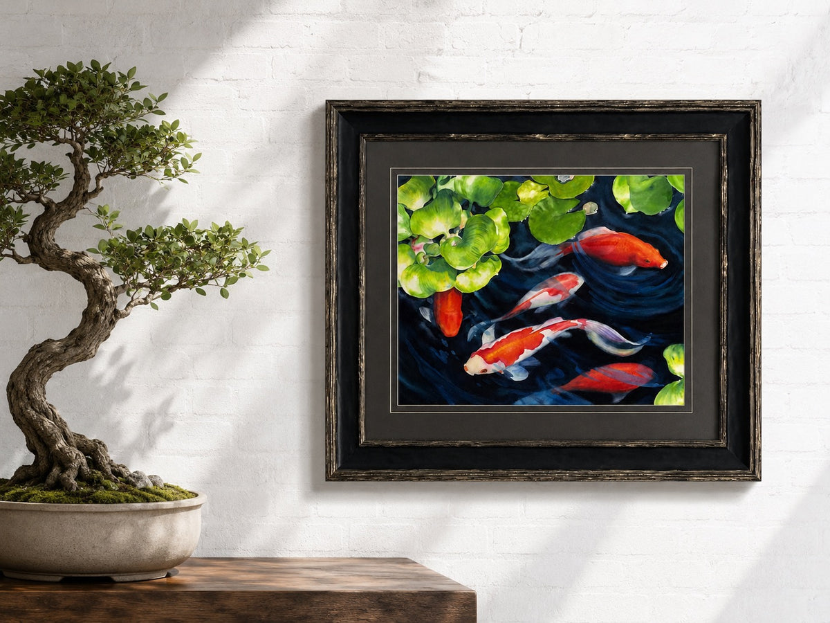 A staged shot of the watercolor artwork by Christie Marie Elder of Koi fish in a dark blue pond professionally framed.