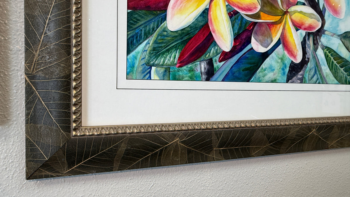 Close-up of the botanically enriched leaf frame and warm metallic detailing on Laʻa Kea o Kekaha
