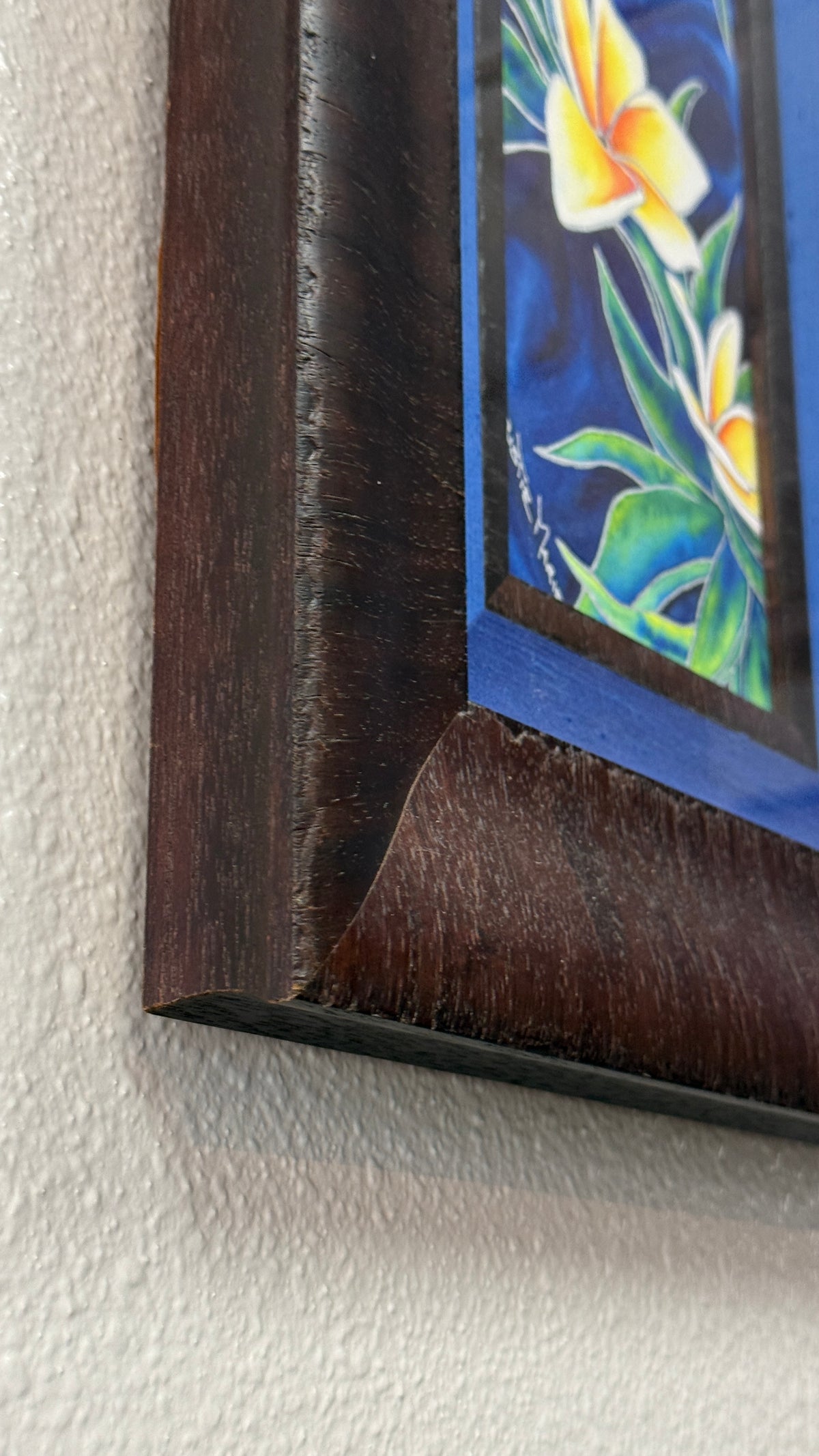 Side detail of Wedding Lei showing the substantial depth and handcrafted presentation of its custom dark wood frame and blue silk liner.