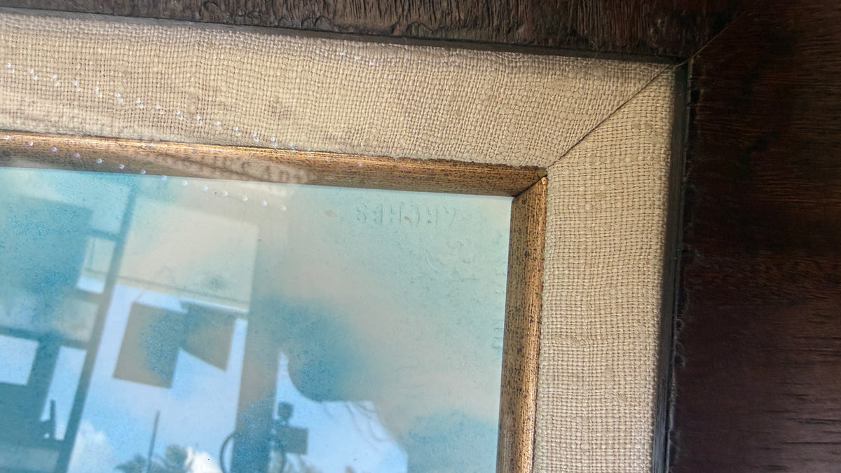 
Close-up of Nani Honu frame showing woven fabric-wrapped liner, mitered corner and gold-toned metallic inner fillet