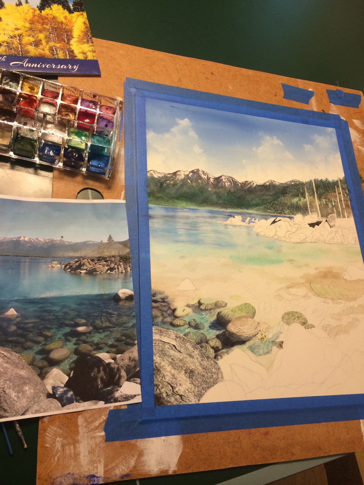 Clear Awakening watercolor in progress with Lake Tahoe mountains and upper lake water established before the foreground granite rocks were completed