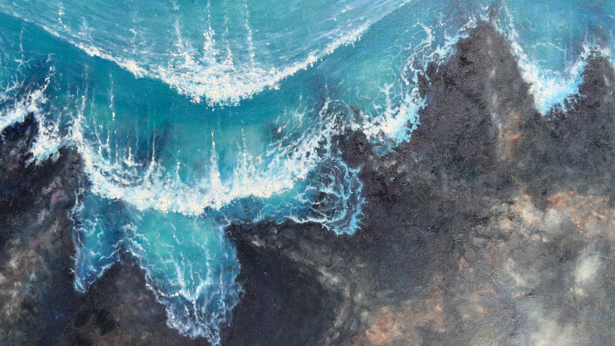 Nalu me nā Nalu up close of the lava rock shore with the turquoise waves crashing