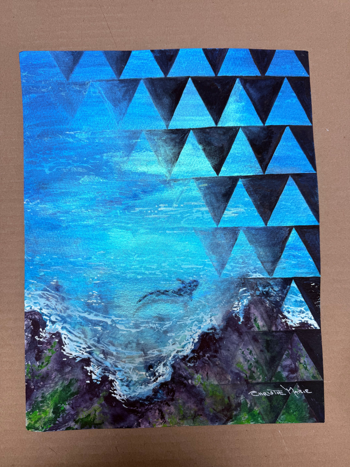 Mano Niho watercolor photographed in bright light showing the shimmer of mineral and gemstone pigments in the ocean