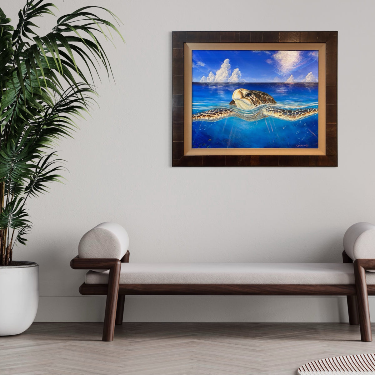 Peace of the Tropics original sea turtle oil painting displayed above a modern wood bench in a tropical-inspired interior