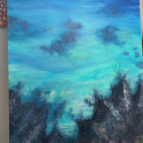 Video of Christie painting in detail into the submerged layer of lava and coral below on the ocean floor.